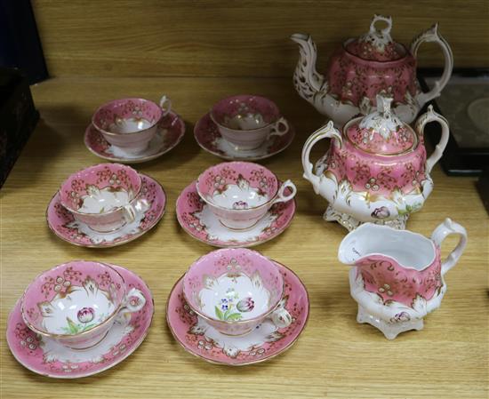A Victorian nine piece porcelain teaset, painted with tulips